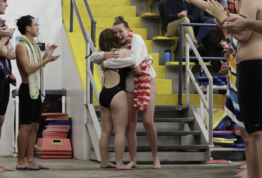 Sophia Altstadt (12, HSU) hugging a teammate her senior celebration. Photo by Allison Underwood