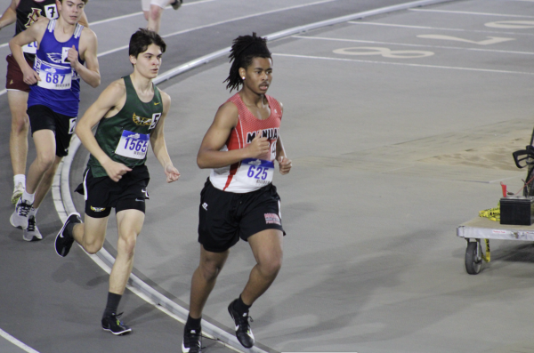 Stephen Smith remains composed while racing one of the boys 800 meter. Photo by Katie Dikes