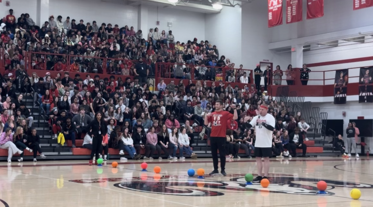 Dr. Newman and Mr. Hartlage (Health) during the pep rally dodgeball game. Photo by Abby Prather