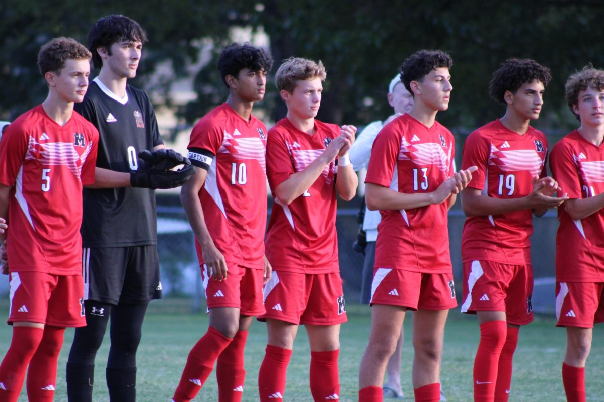 Manual boys starters line up as called upon by announcer.