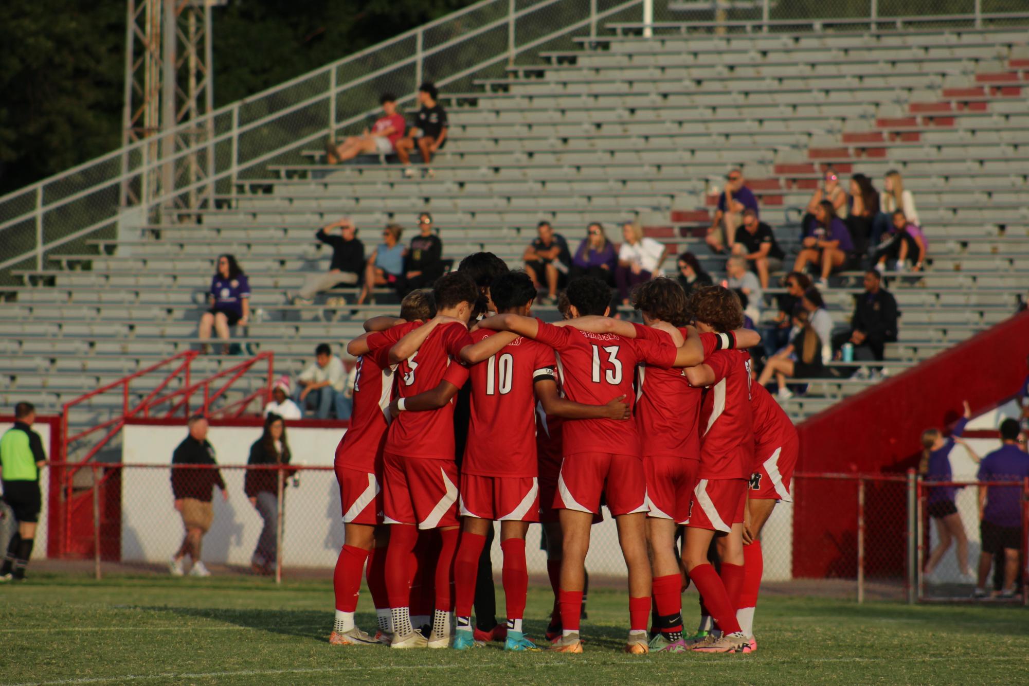 Manual Boys' Soccer team huddles before rivalry matchup against Male.