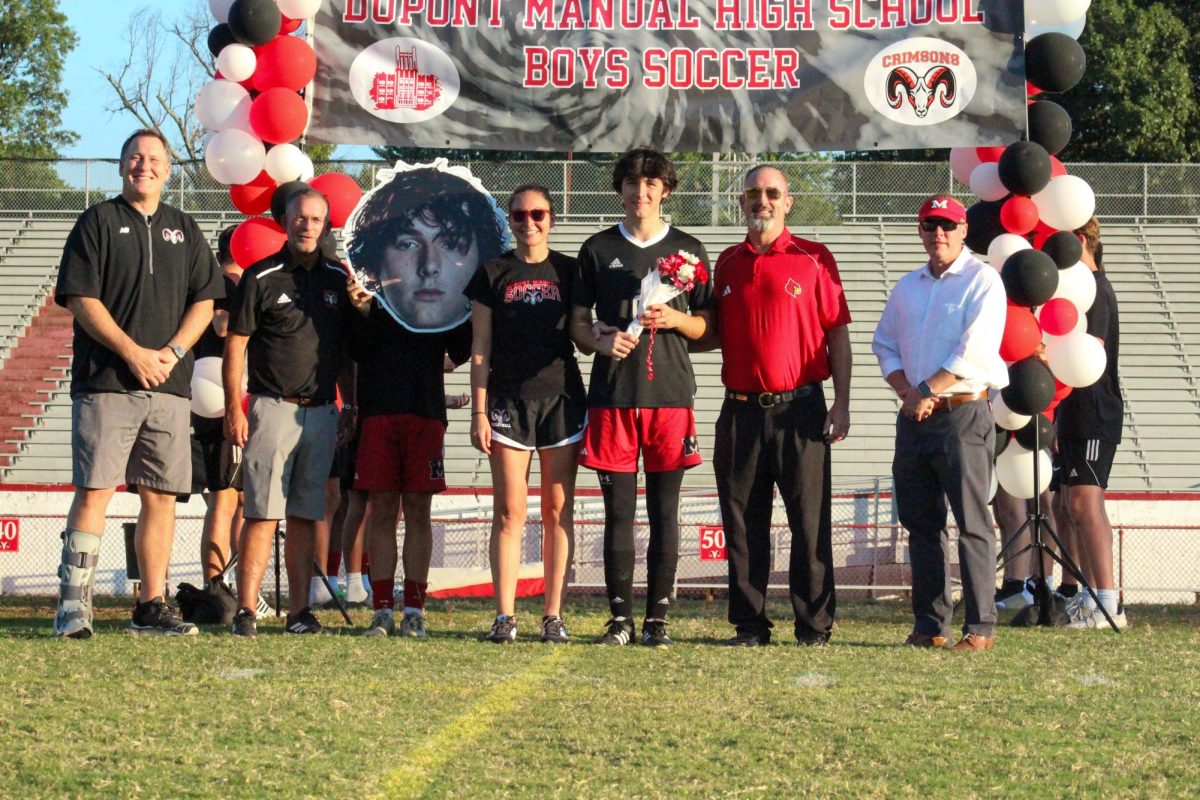 Gavin Fulton (#0, 12) and his family during the senior night walk out. 