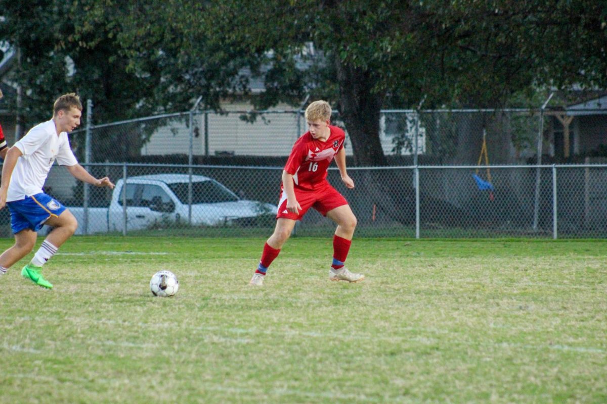 Kyle Mertz (#16, 12) defending against Brown's offense.