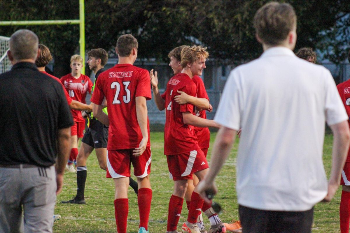 Manual bench congratulating teammates after the end of the first half.