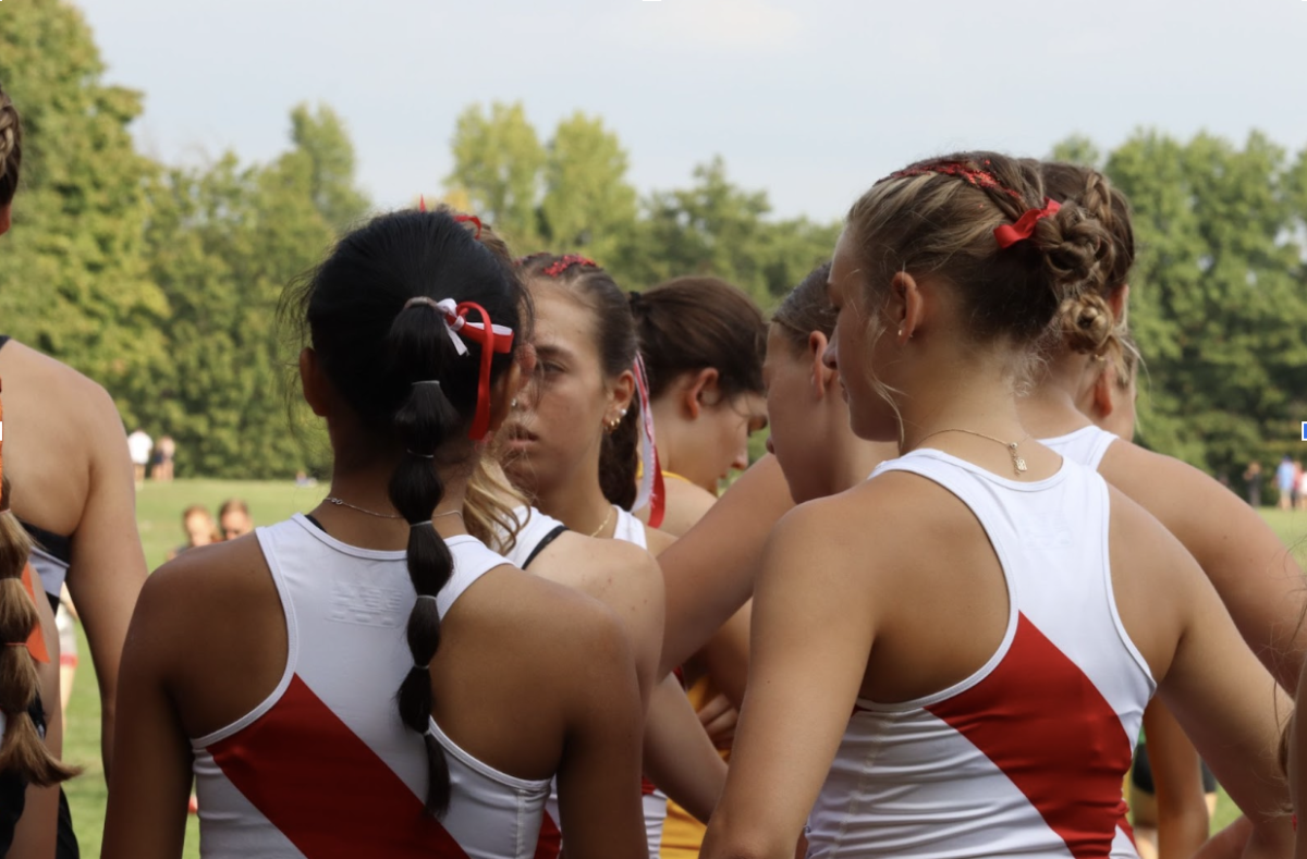 A few of the girls' team runners get ready to race. 