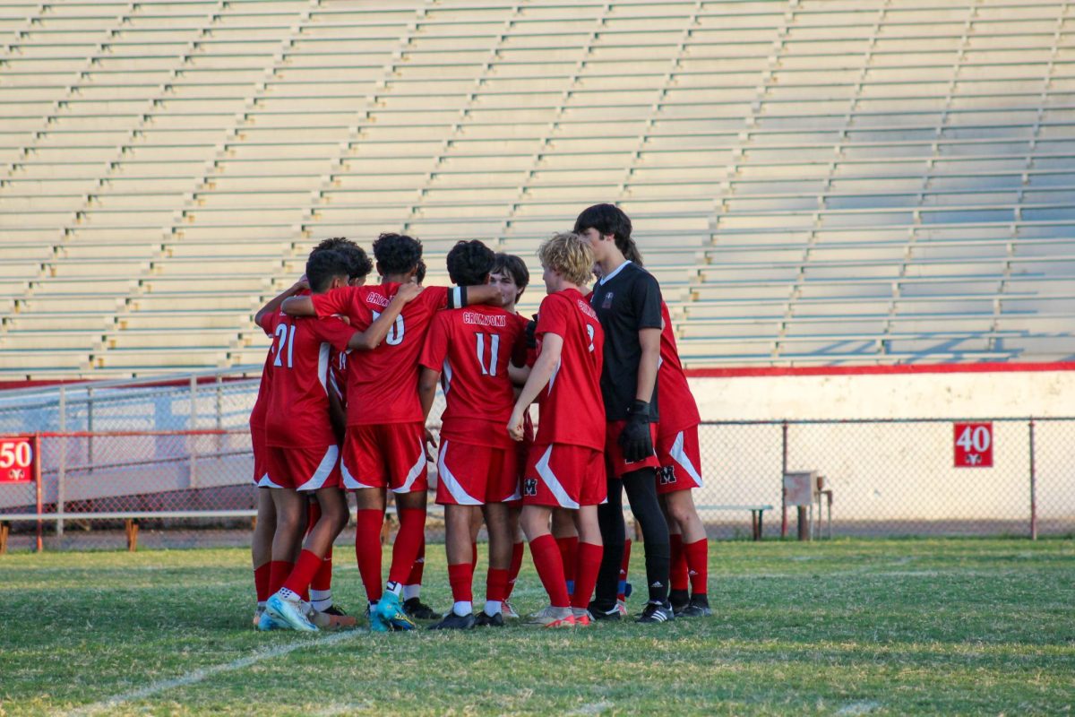 Starting line-up having a team talk before the game. 