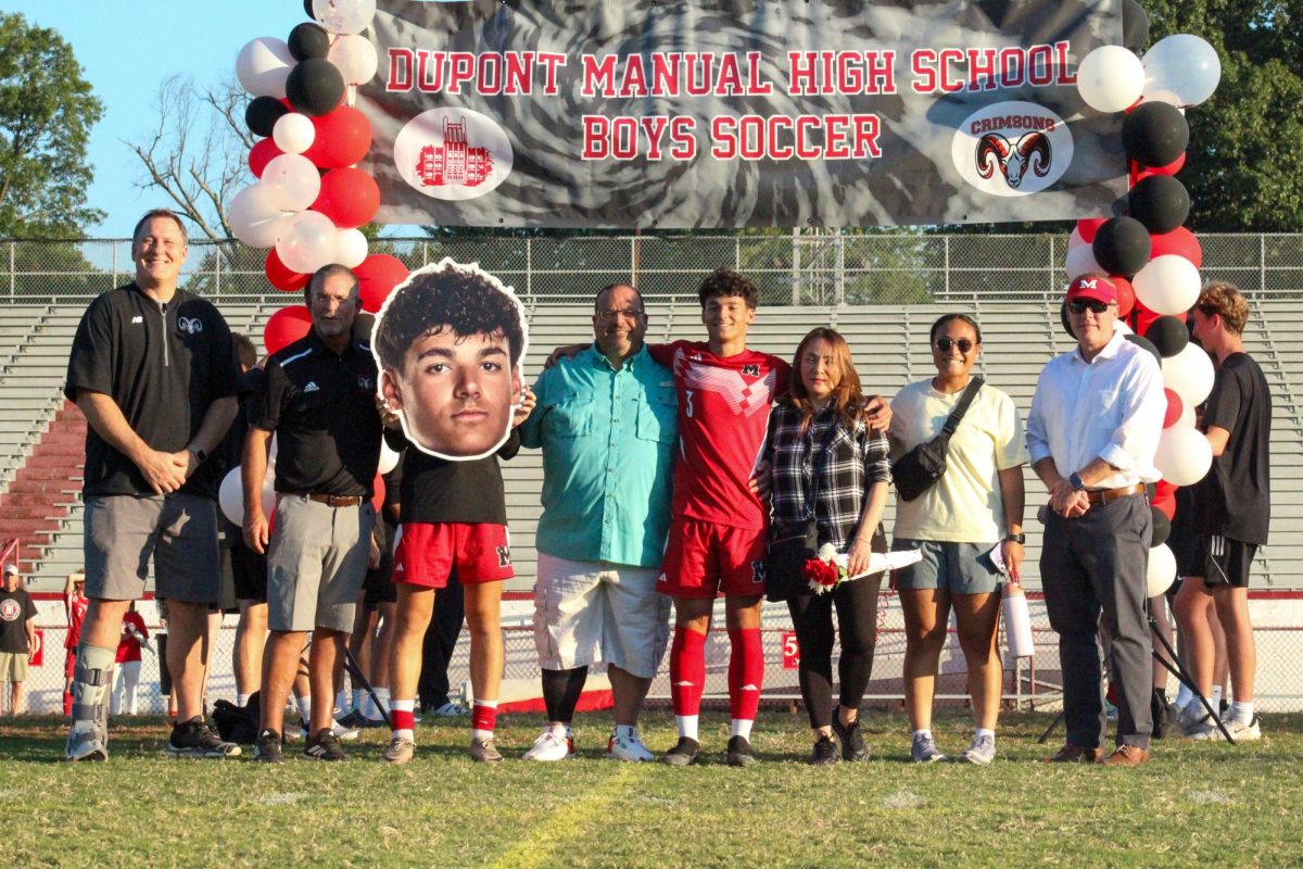 Taysir "Tito" Khatib (#3, 12) and his family walking out during the senior night celebration.