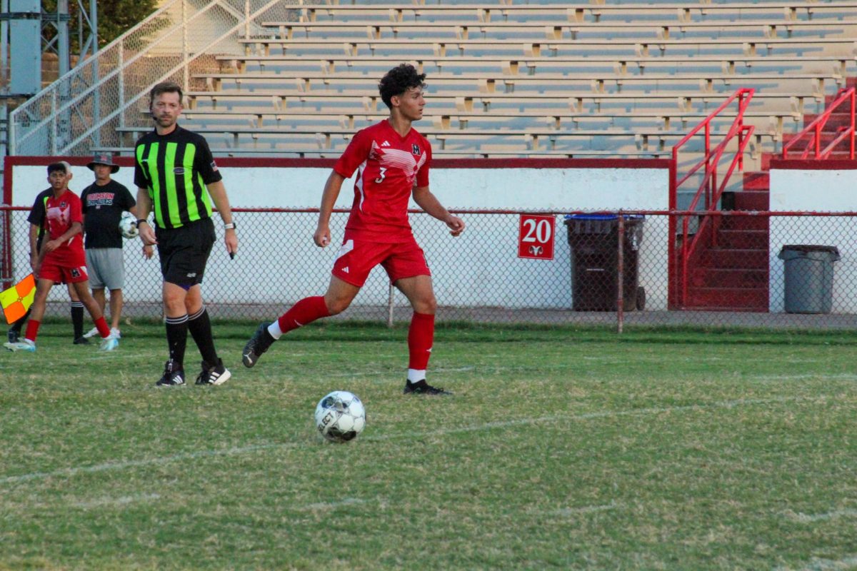 Taysir "Tito" Khatib (#3, 12) receiving the ball from teammate.