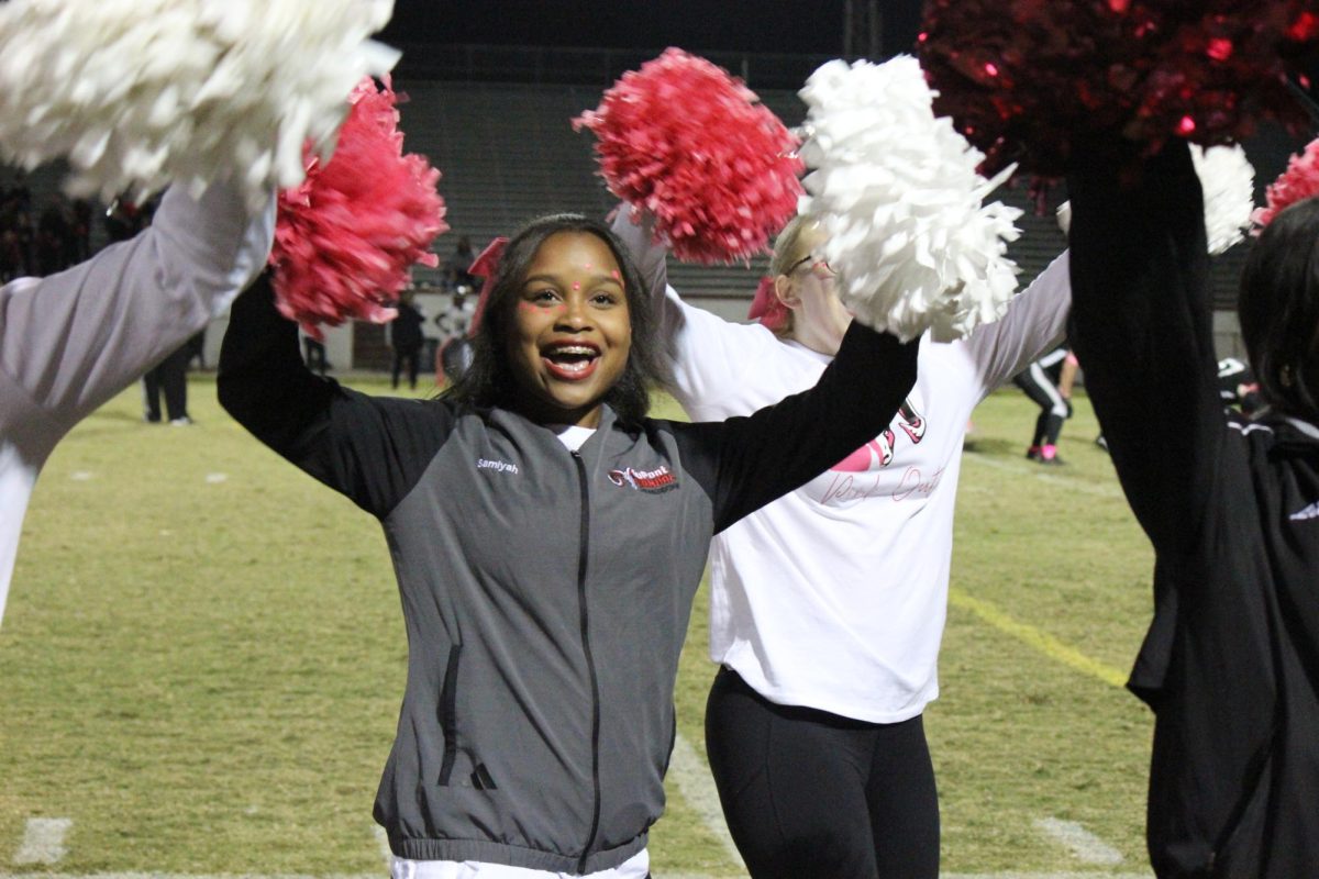 Cheerleader Samiyah Taylor and the rest of the cheerleading team don their pink and white pom-poms for the pink-out. 