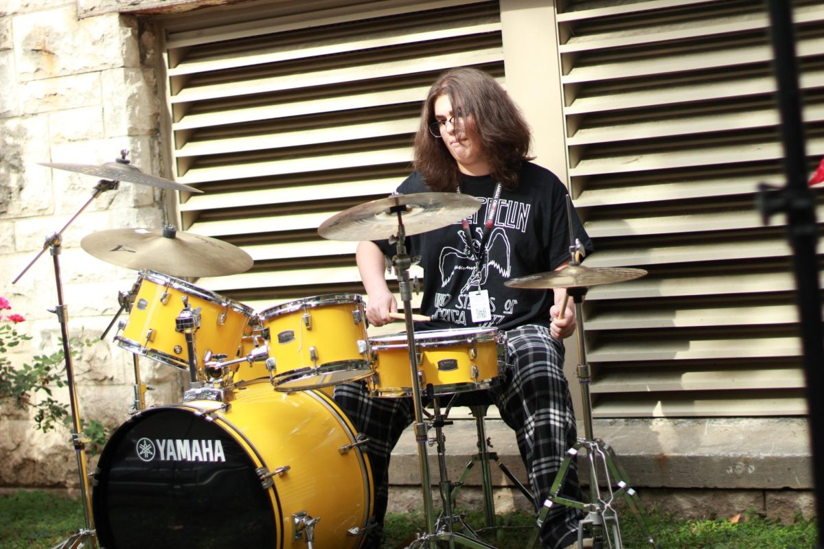 Noah Chudgar (12, YPAS) playing the drums in S p a c e's performance. 