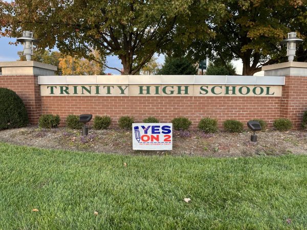 A "Yes on 2" sign outside Trinity High School highlights the private school's stance on Amendment 2.