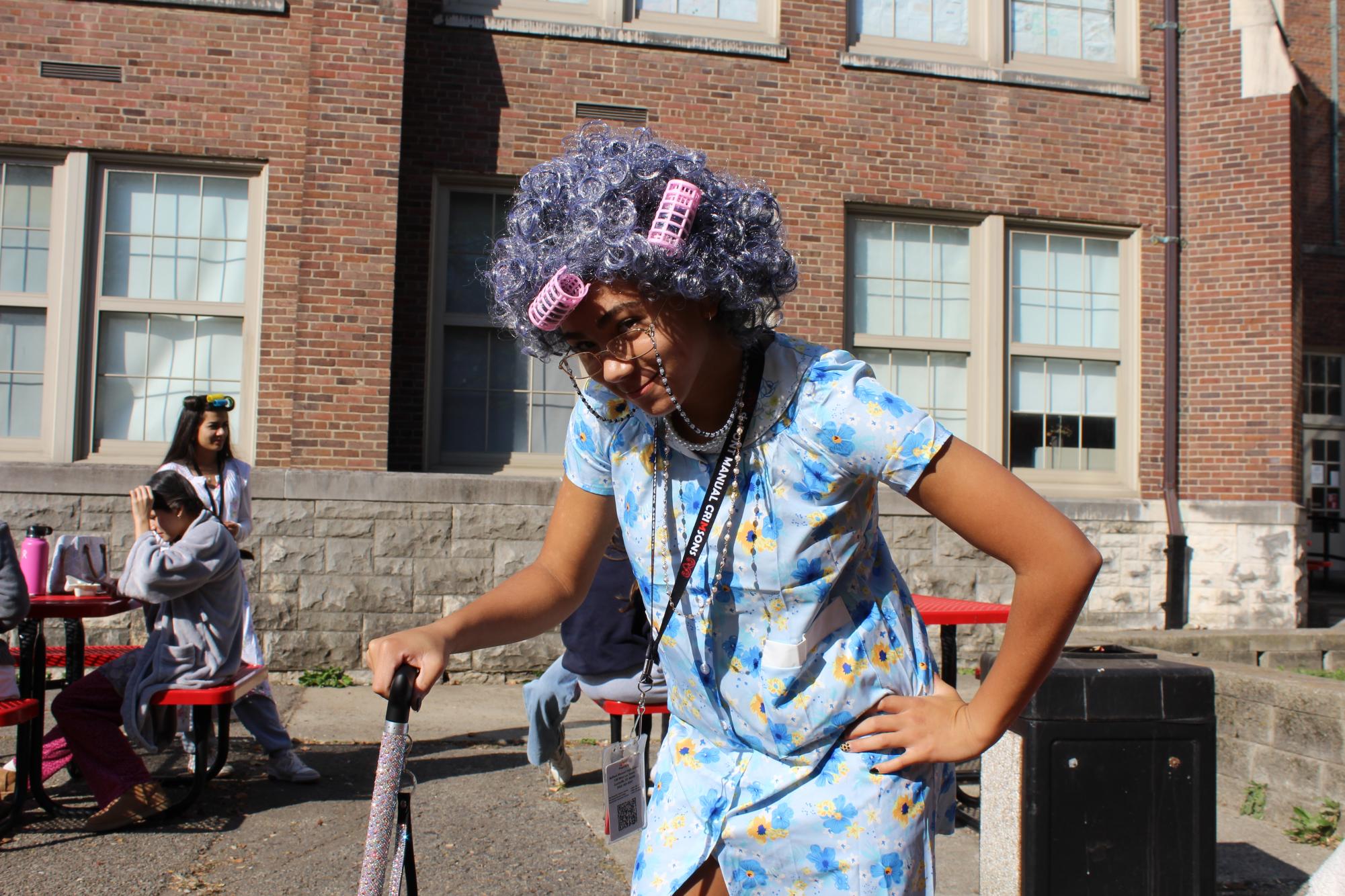 Katelyn Cormney (9, HSU) poses with a cane to show off her costume. 