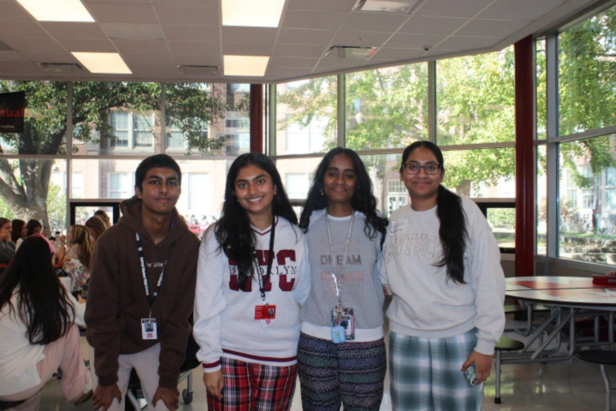 A group of MST students smile for the camera in their pajamas