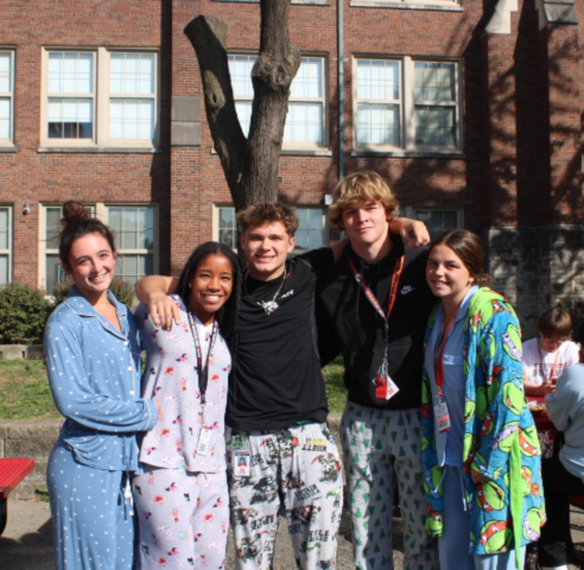 A group of students enjoy lunch together in their pajamas