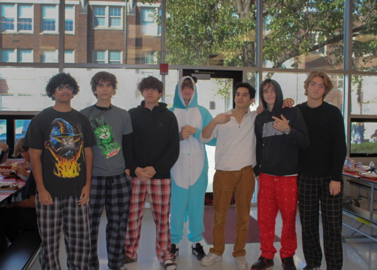 A group of seniors pose for the camera in their pajamas 