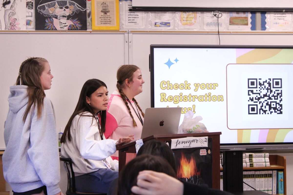 Lucy Vanderhoff (12, J&C), Mali Bucher (12, J&C) and Sarah Catlett (10, YPAS) presenting to Girl Up members.