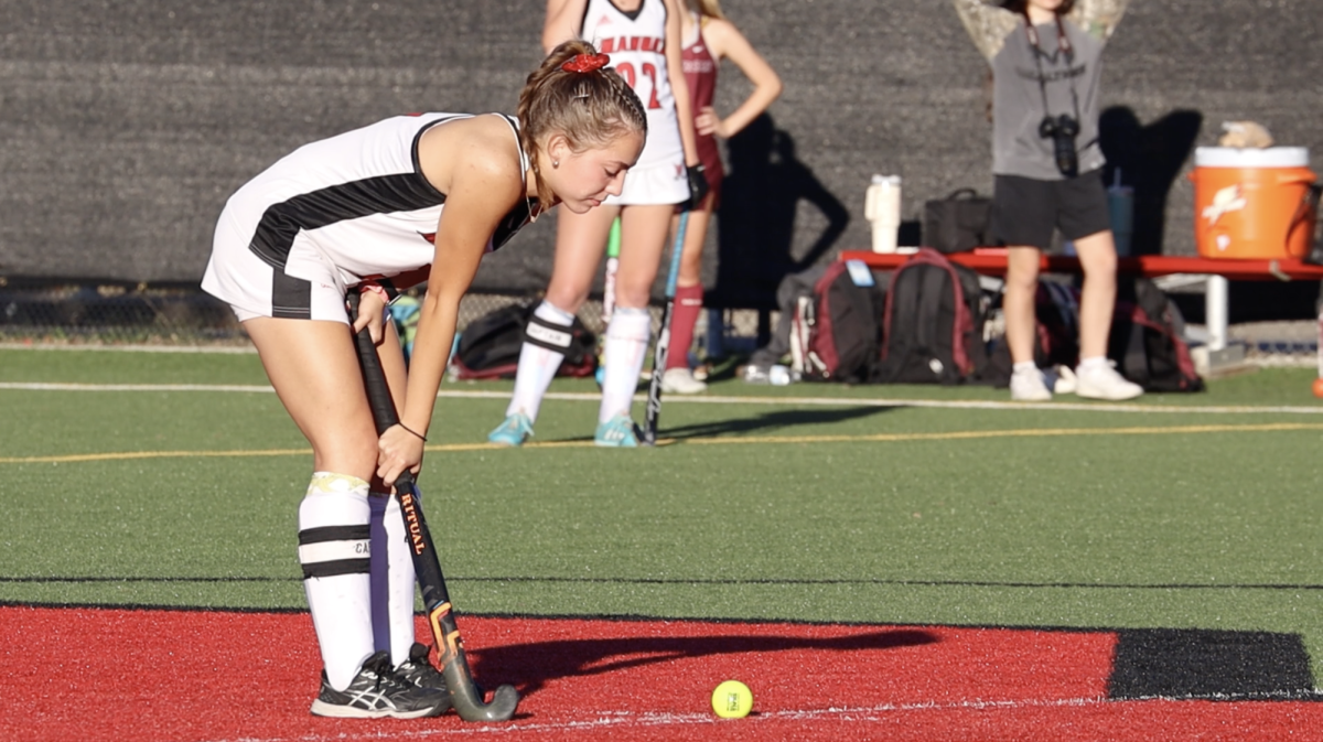 Dawson Packwood (#3, 12) prepares to pass the ball from mid-field.