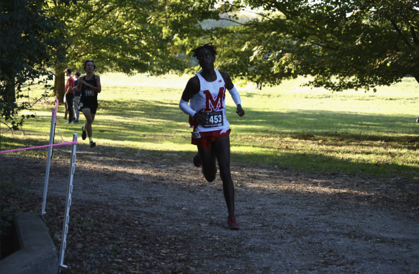 Tedi Henderson (12, HSU) eyes the next part of the course after rounding a corner. 