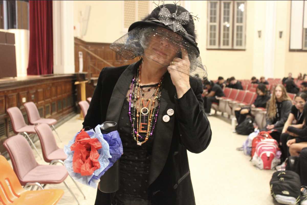 Dr. Carrie Coaplen (English) attends the funeral in her mourning clothes. 