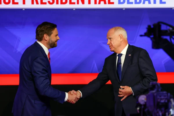 JD Vance and Tim Walz greet each other on stage at the 2024 vice presidential debate. Photo by Michele Crowe courtesy of CBS. 