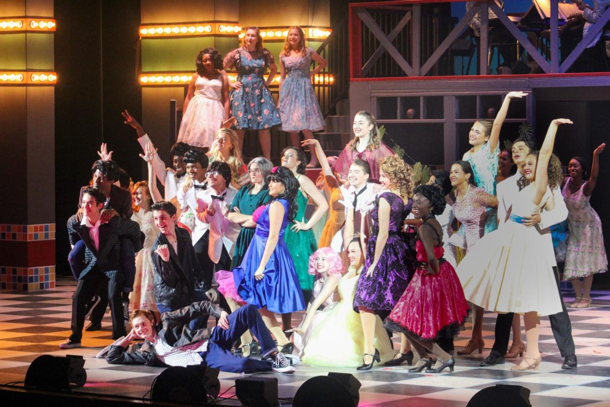 The cast pose at the end of a musical number.