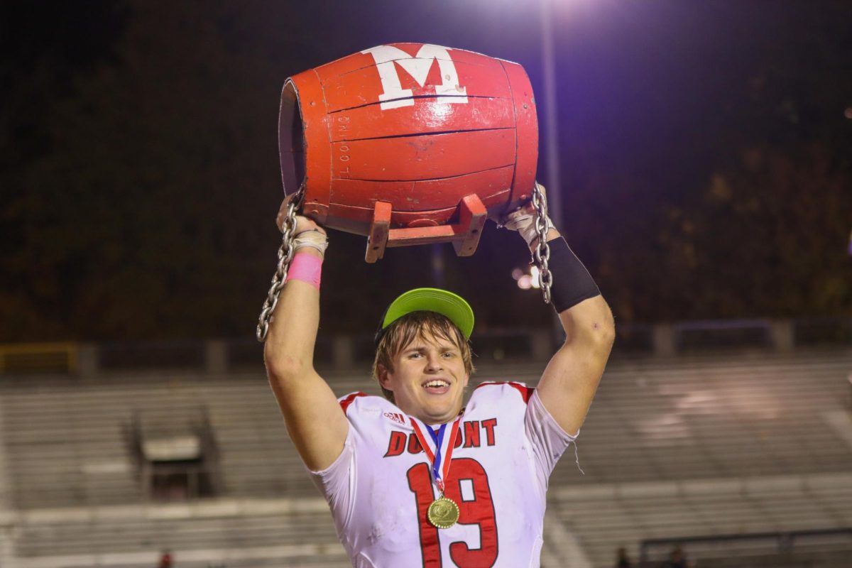 Cameron Jessee lifts up the Barrel after defeating the Male Bulldogs in the annual "Old Rivalry" matchup. 