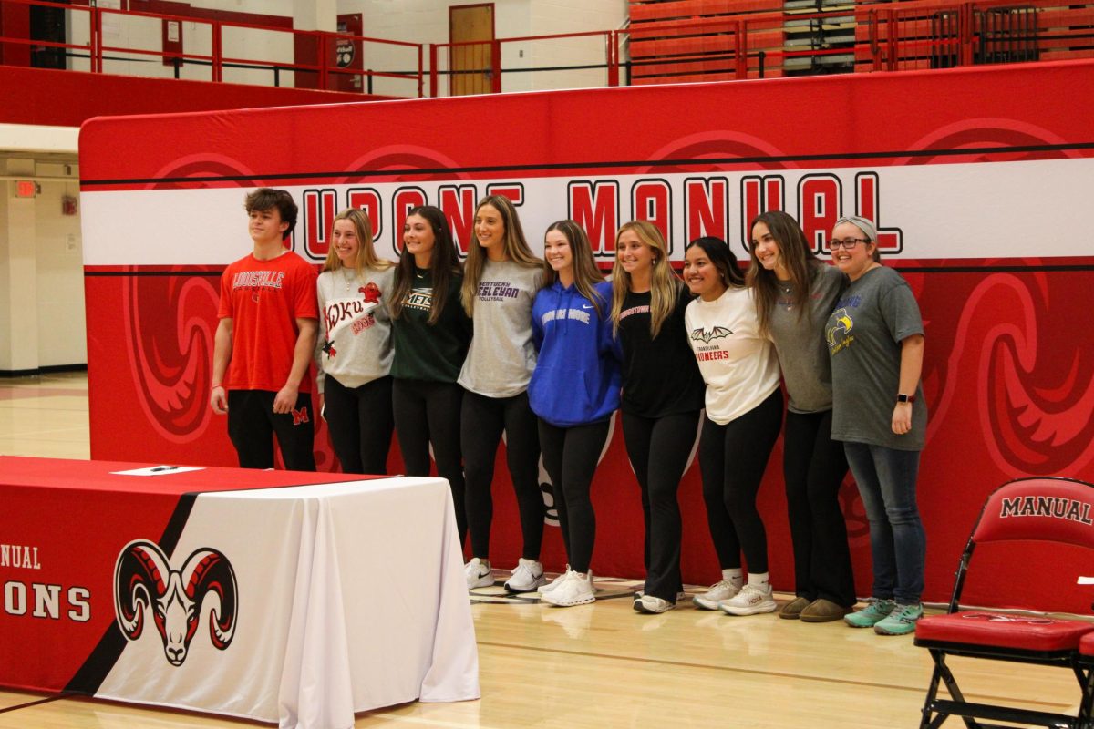 The nine senior athletes pose together for a picture. 