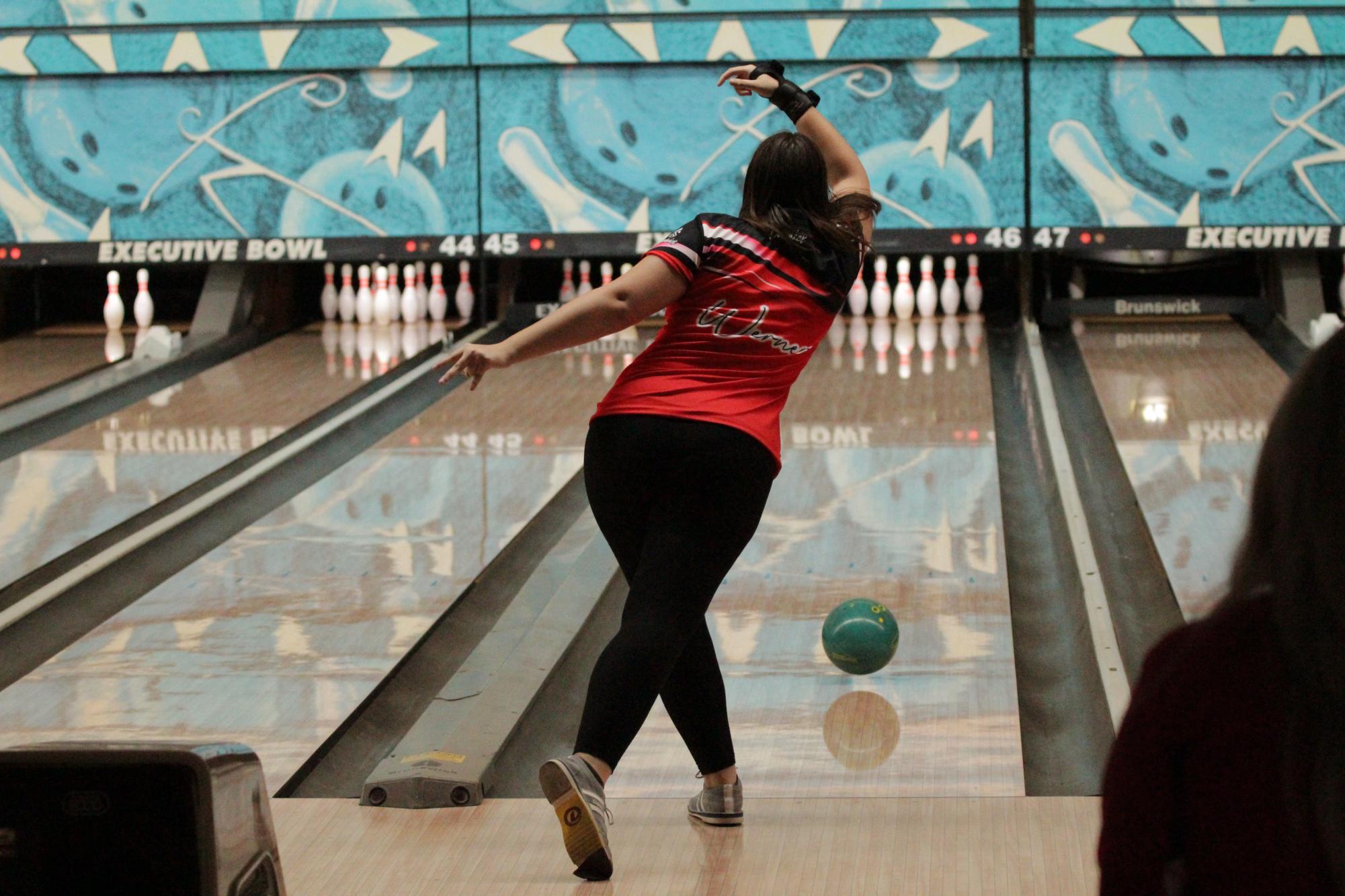 Jordyn Werner (#69, 12) follows through after releasing the ball from her hand. 