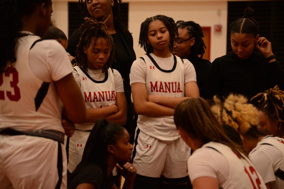 The team huddles together during a time out. 