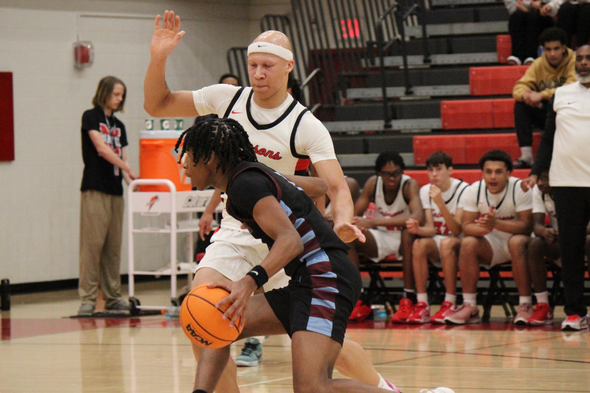 Justice Decker (#1, 12) defending against Jeffersontown again.