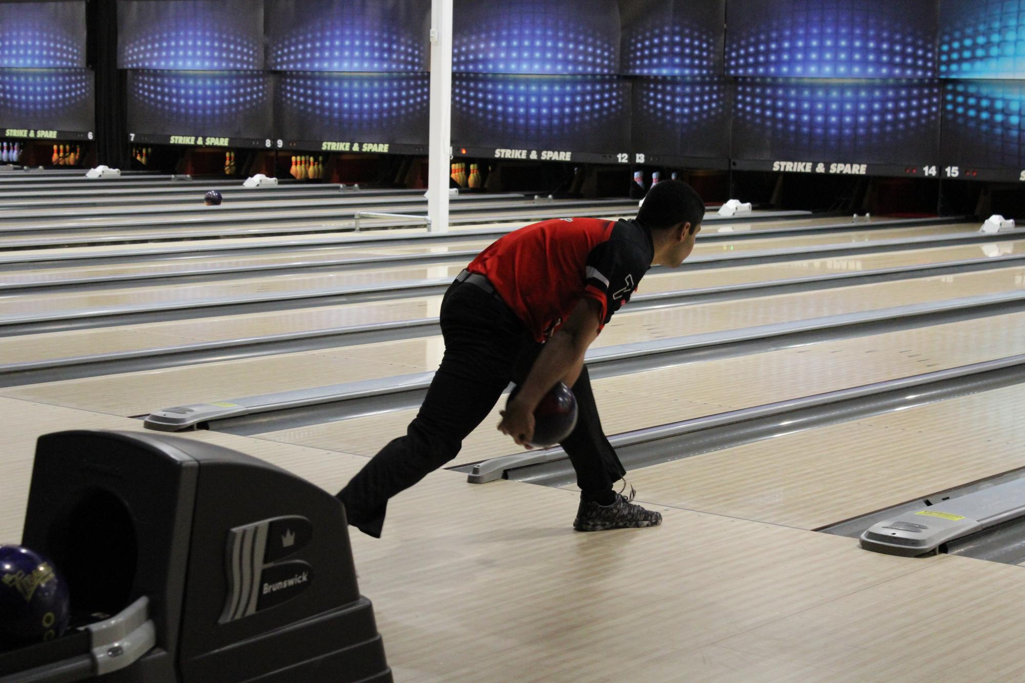 Caleb Seow (12, MST) prepares to release the ball from his hands during the match against Male. 