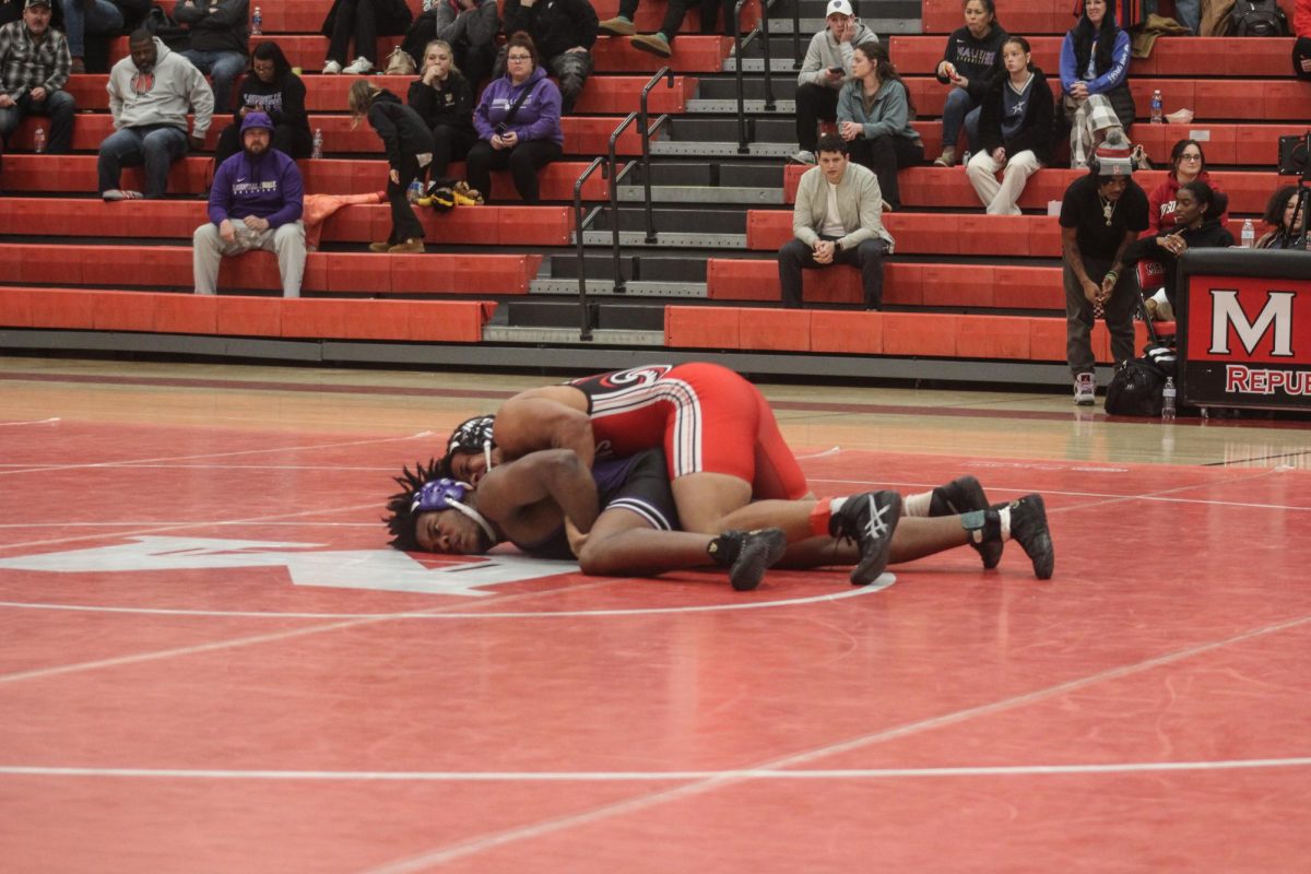 Devin Allen (11, HSU) after a takedown_