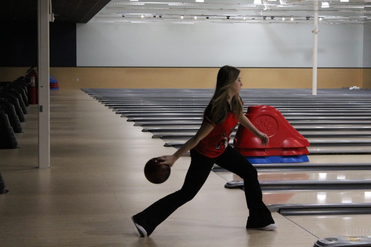 Liv Kunkle (#8, 12) starting her swing during bowling.