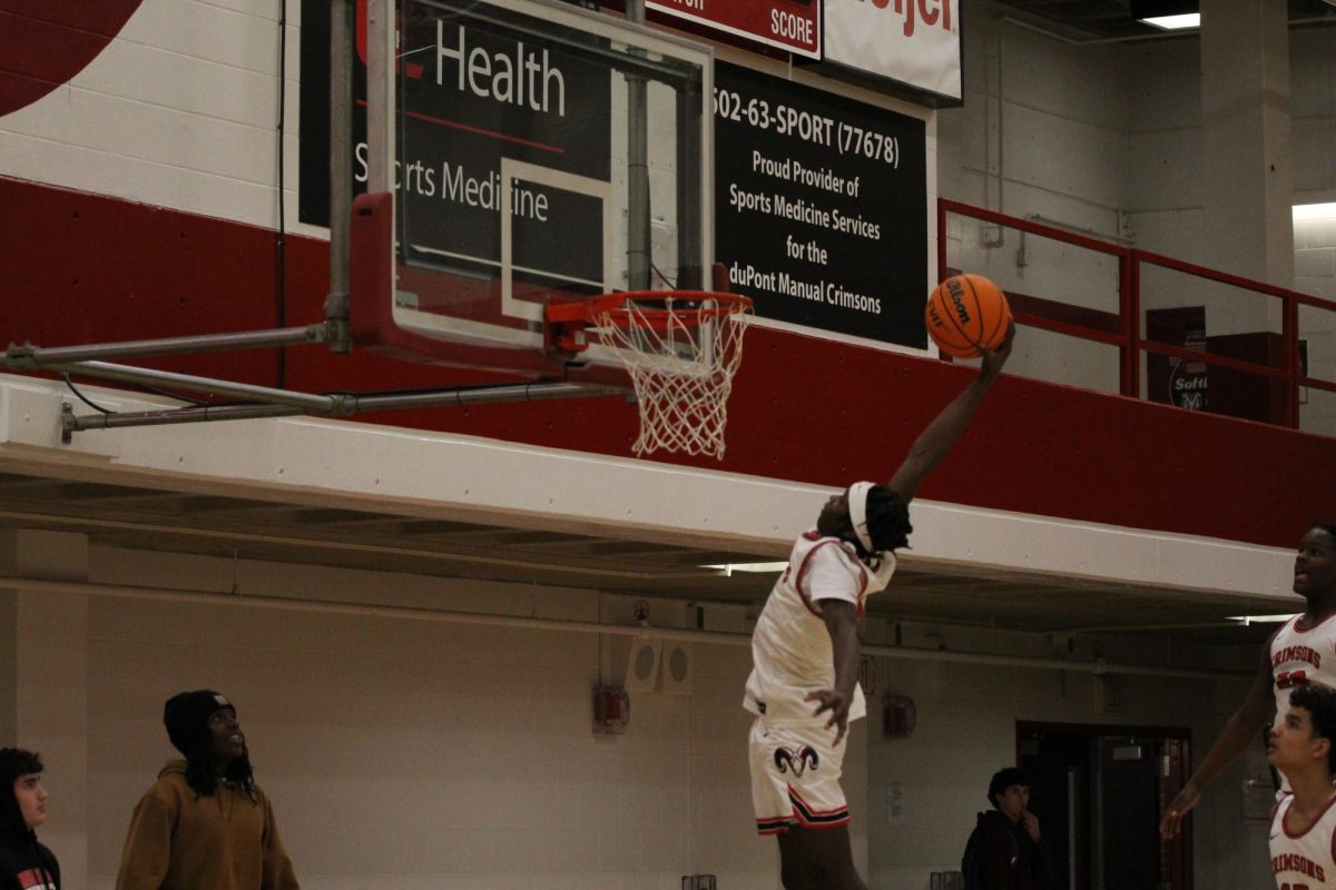 Malachi Towns (#2, 10) dunks during warm ups.