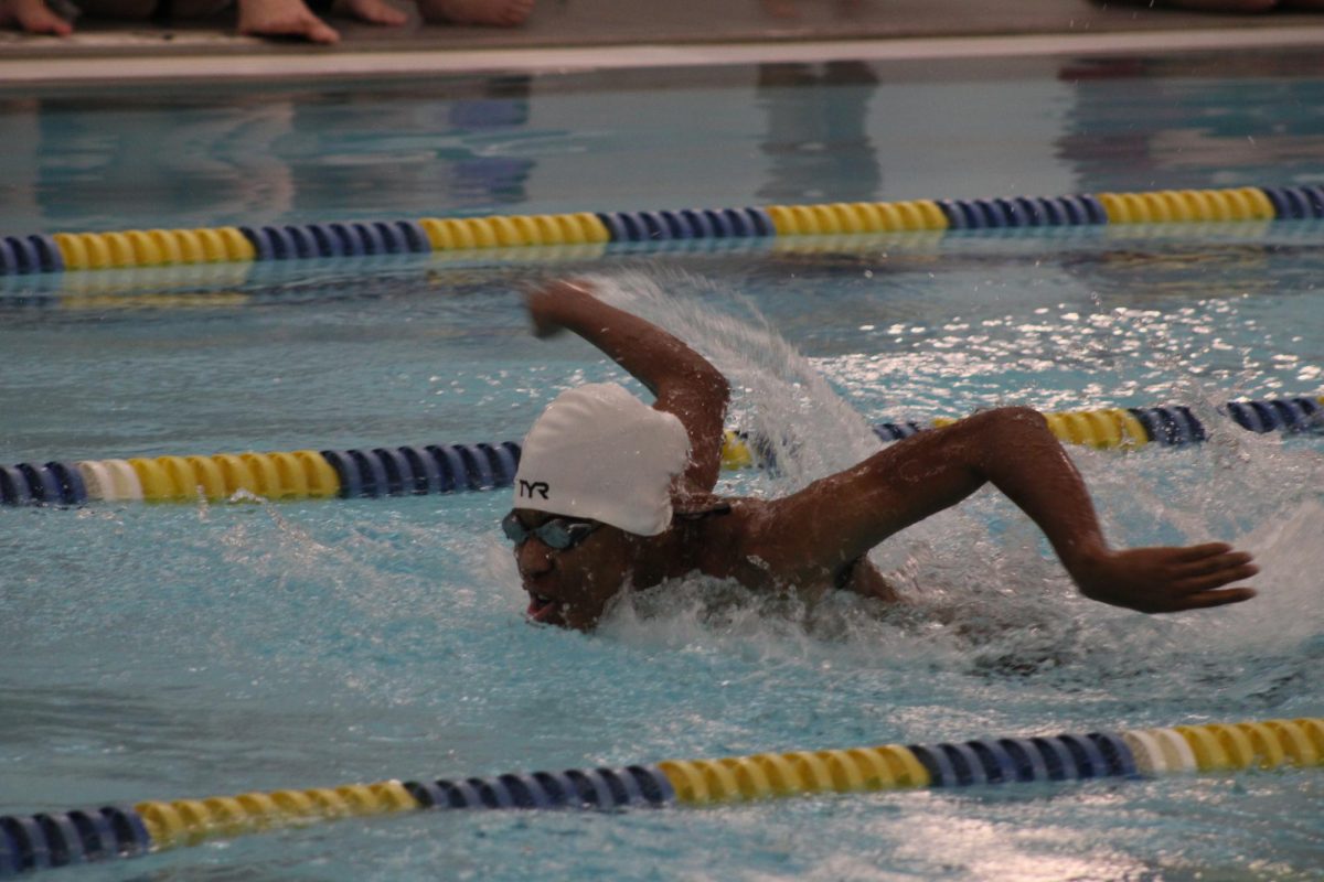 Nathaniel Bishop (12, HSU) swims the butterfly.