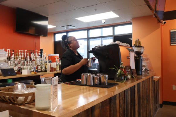 Brew & Sip the Cafe and Roastery owner Latoya Cook-Bradley making coffee orders.