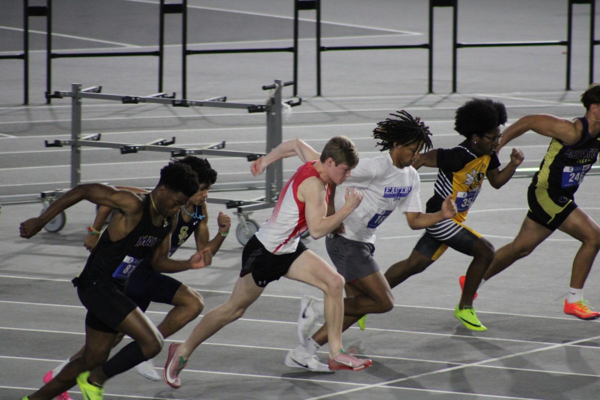 Evan Owens (11) takes off during one of many heats for the men's 60-meter dash.