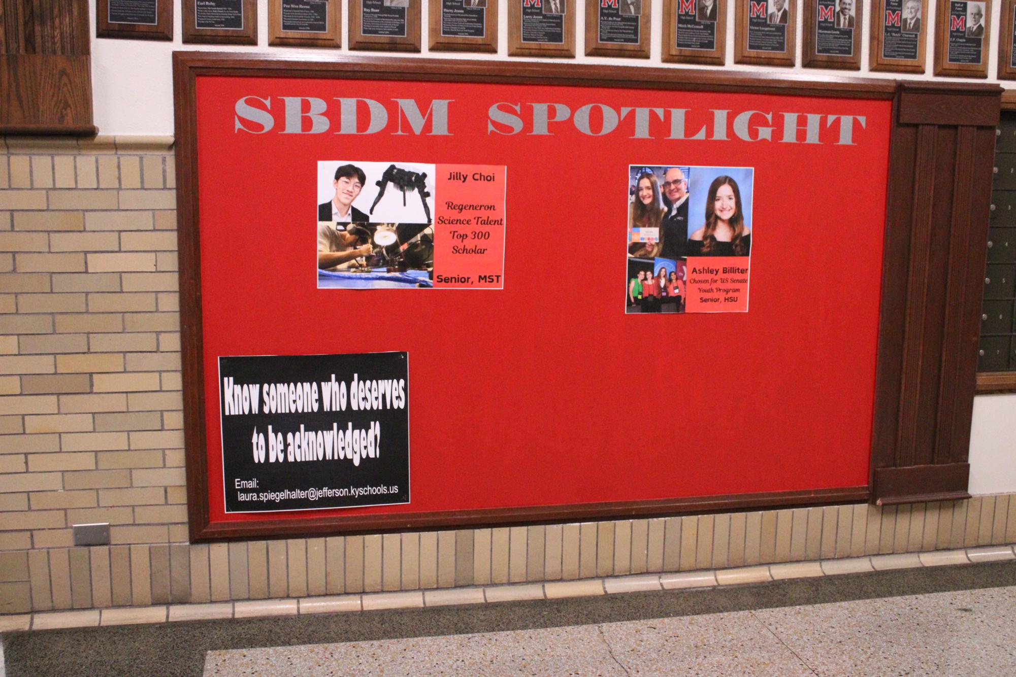 SBDM's billboard posted outside the office highlighting student successes. 