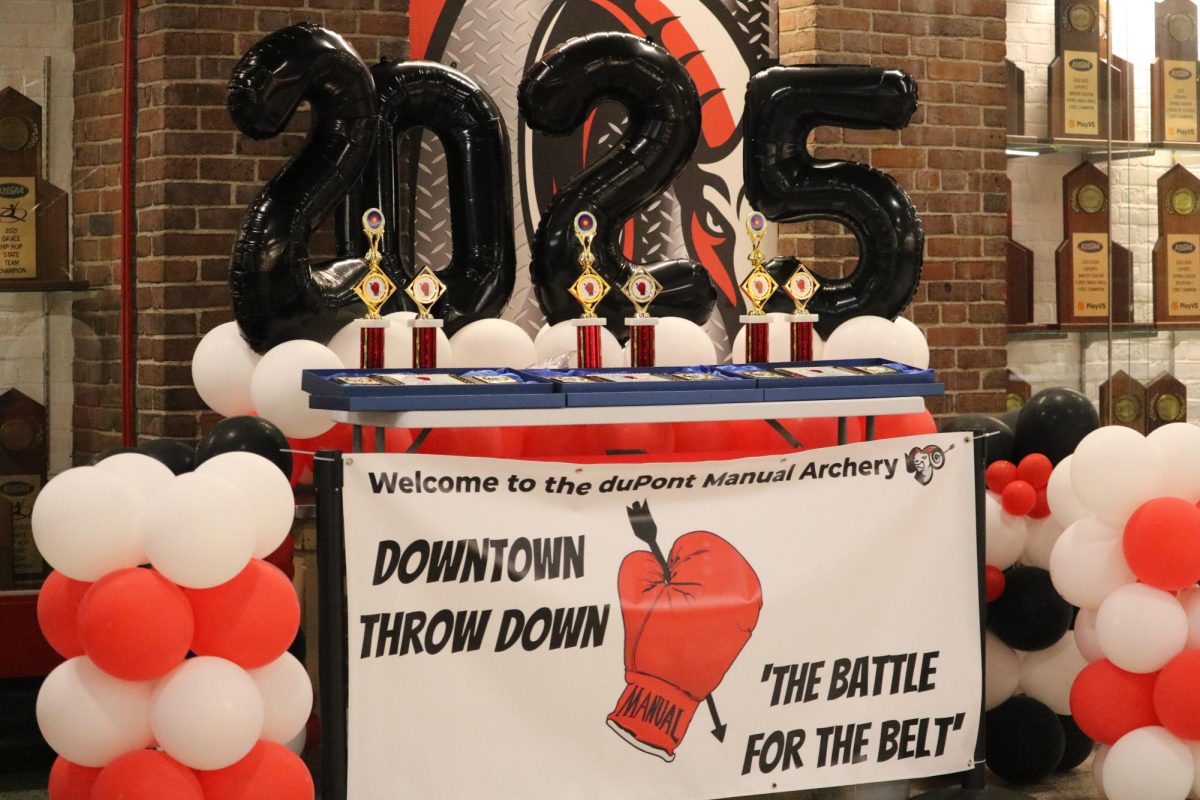 Entrance sign for the tournament, displaying trophies and awards for the winners. 