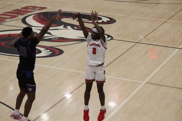 Malachi Towns (#2, 10) jumps up to shoot the ball. 