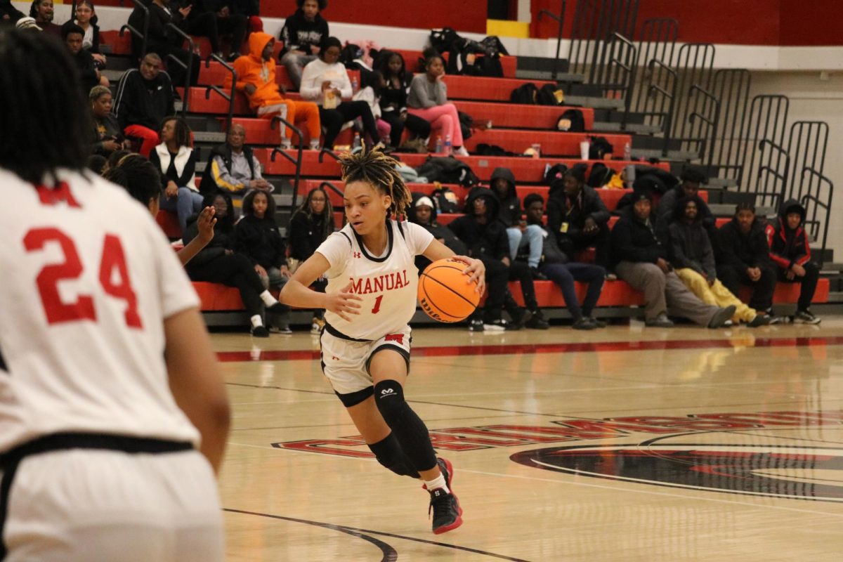 Takenzie Young (#1, 9) tries to maneuver around Central players.