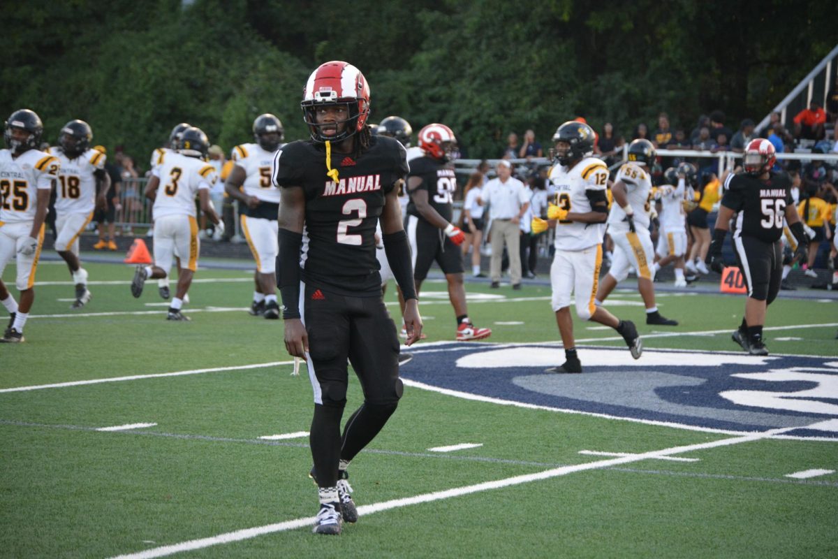 Dequoria Warner (#2, 12) walks through the field.