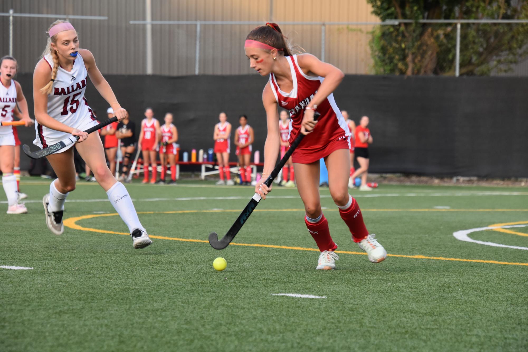 Forest Faversham (#5, 9) keeps the ball away from a Ballard player.