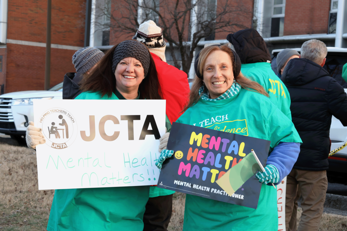 JCTA member and Stephanie Barclay protest against the removal of mental health practitioners from JCPS schools. 