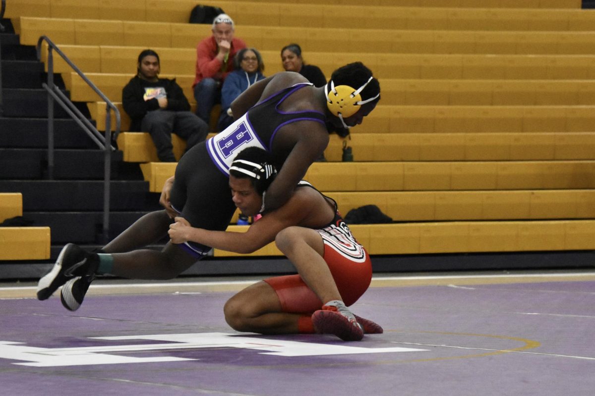 Harrison Wilson (11, HSU) flipping his opponent.