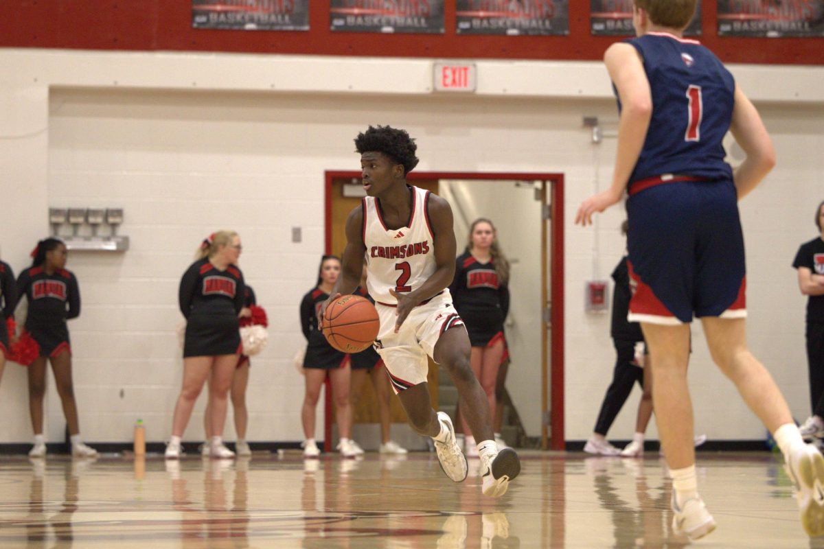 Aubrey Jones Williams (#2, 9) moves the offense forward after the score, looking to set up the next play.