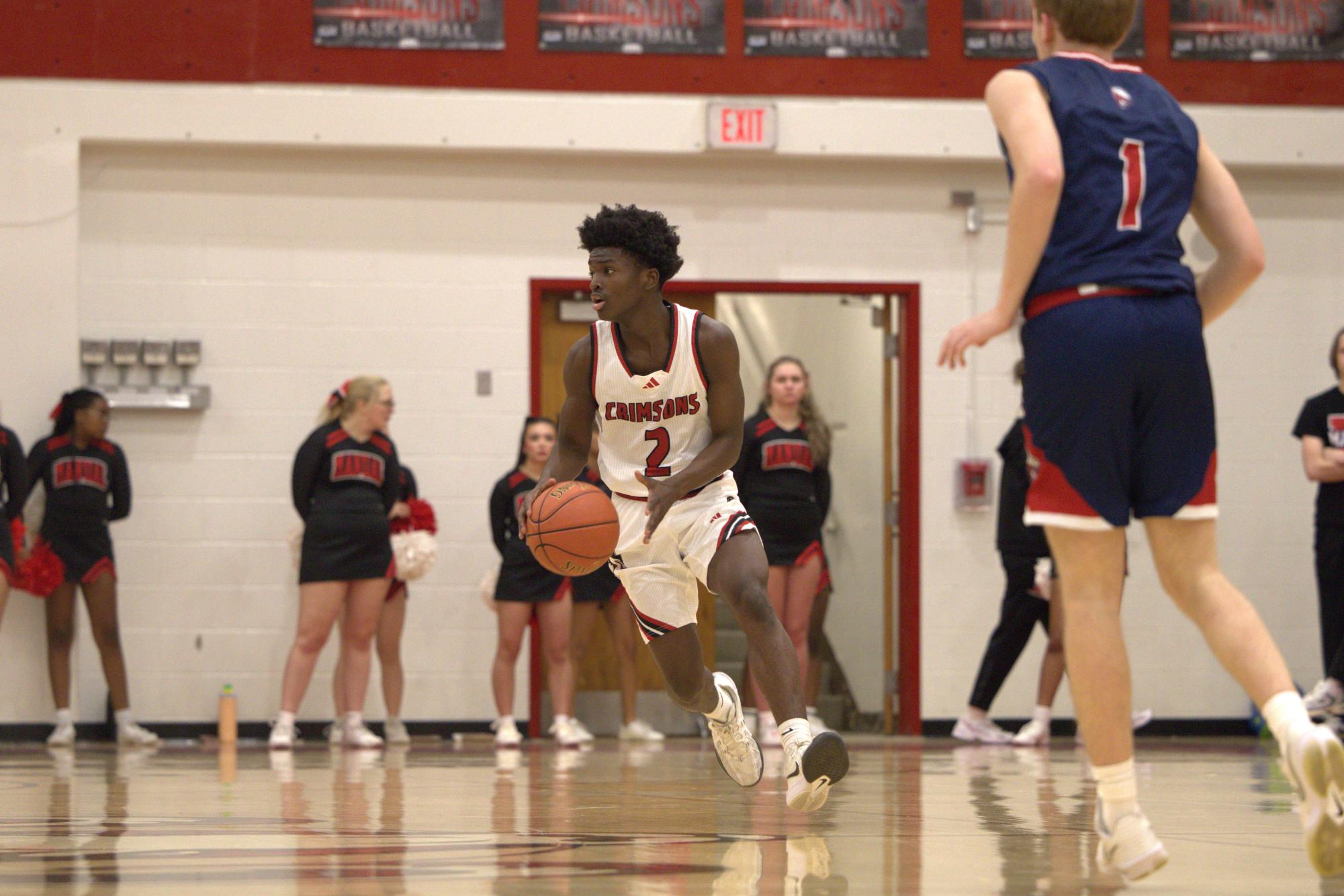 Aubrey Jones Williams (#2, 9) moves the offense forward after the score, looking to set up the next play.