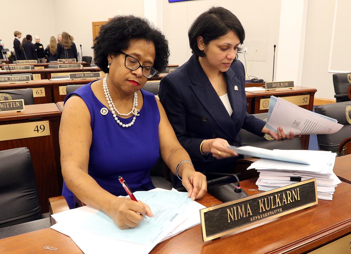 Rep. Beverly Chester-Burton and Rep. Nima Kulkarni work on a bill together. Photo courtesy of LRC Public Information.