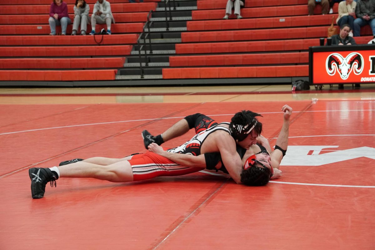Michael Hardy (12, MST) pining his opponent down.