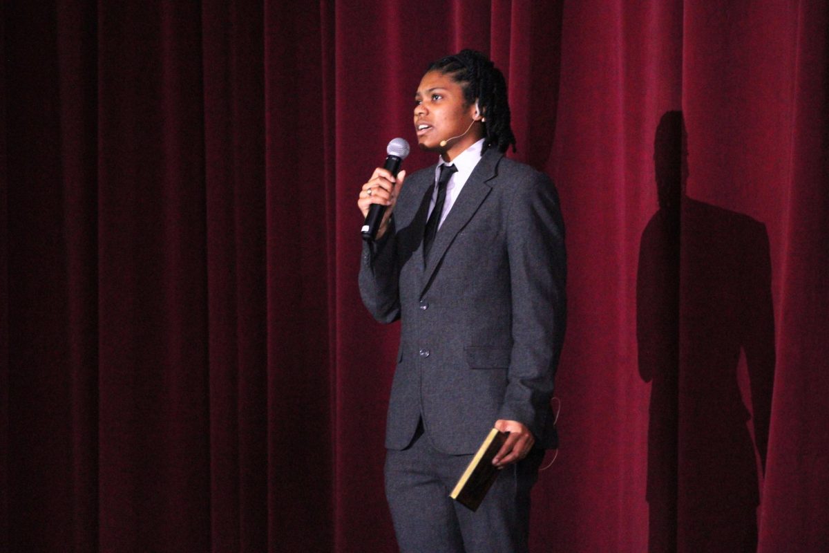Kennedy Miles (12, J&C) recites a poem at Manual's annual Black History Month program. 